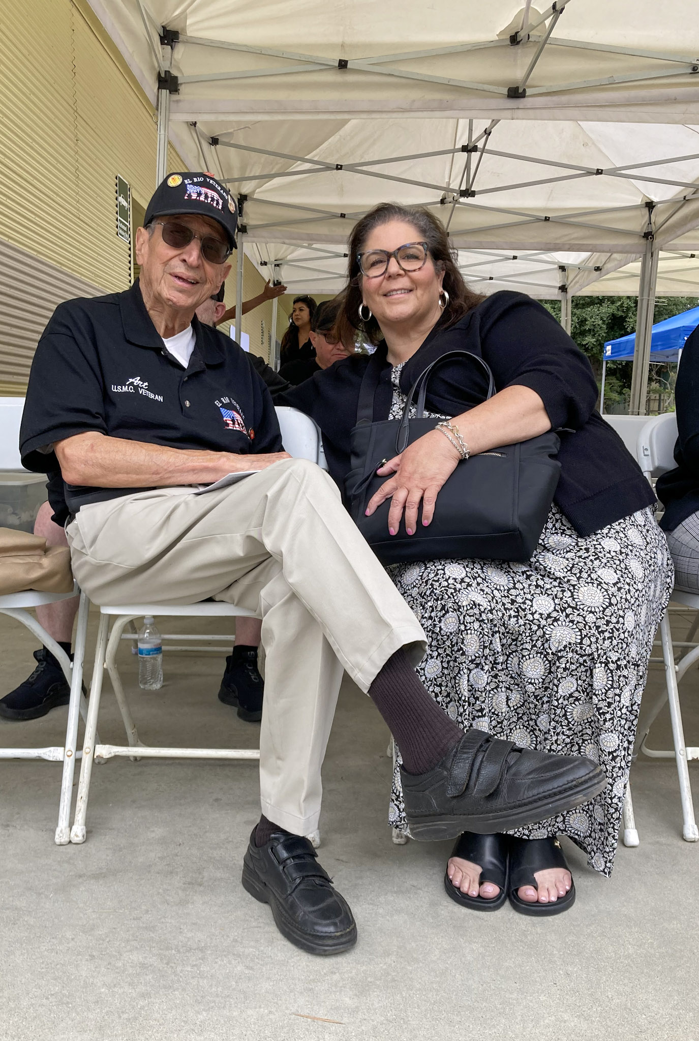 Community leaders and priest seated